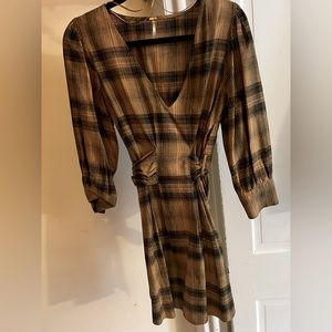 Never worn Free People mini dress with mid length sleeves.